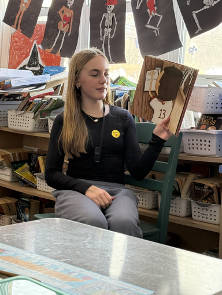 Seventh grade Mindfulness Ambassador reads to fourth graders